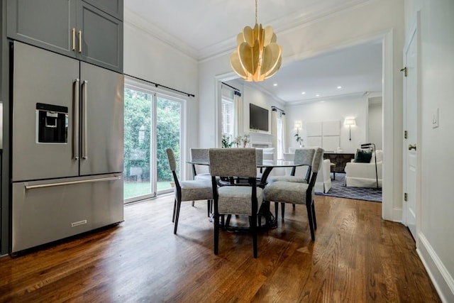 663 Clifton Rd NE, Atlanta, GA 30307 - dining area featuring ornamental molding, dark wood-type flooring, and baseboards