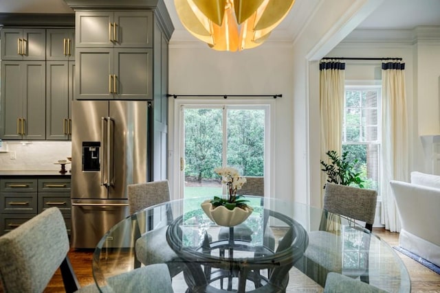 663 Clifton Rd NE, Atlanta, GA 30307 - dining space with ornamental molding, wood finished floors, and a chandelier