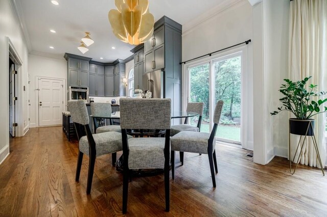663 Clifton Rd NE, Atlanta, GA 30307 - dining area featuring ornamental molding, dark wood-type flooring, recessed lighting, and baseboards
