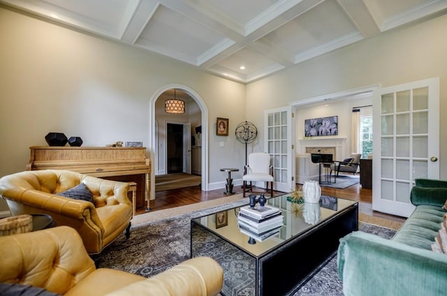 663 Clifton Rd NE, Atlanta, GA 30307 - living area with coffered ceiling, wood finished floors, arched walkways, beam ceiling, and french doors