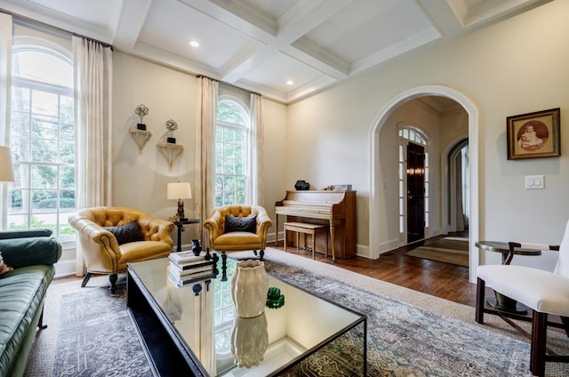 663 Clifton Rd NE, Atlanta, GA 30307 - living room featuring arched walkways, coffered ceiling, wood finished floors, beam ceiling, and baseboards