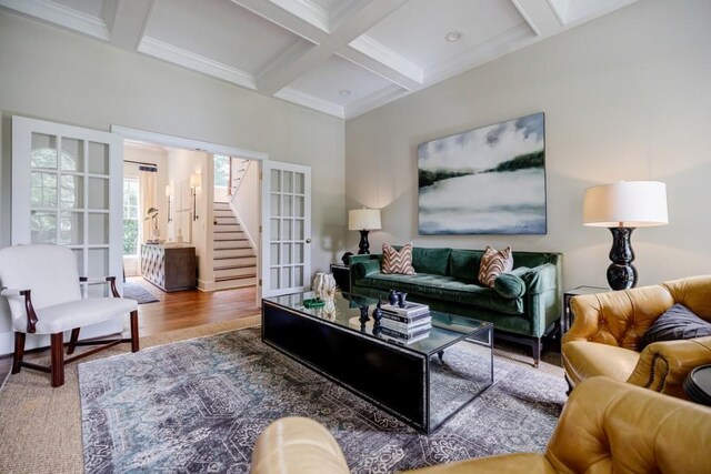 663 Clifton Rd NE, Atlanta, GA 30307 - living room featuring coffered ceiling, beam ceiling, french doors, stairway, and crown molding