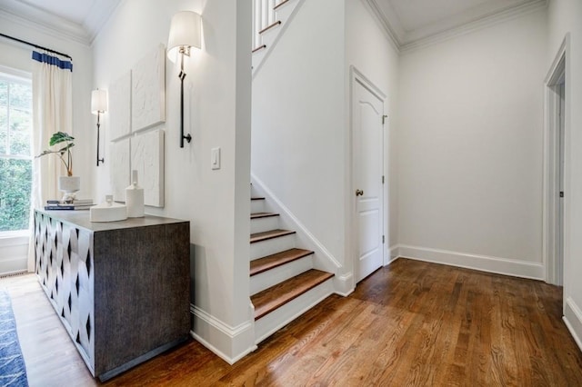 663 Clifton Rd NE, Atlanta, GA 30307 - hallway with crown molding, plenty of natural light, stairs, wood finished floors, and baseboards