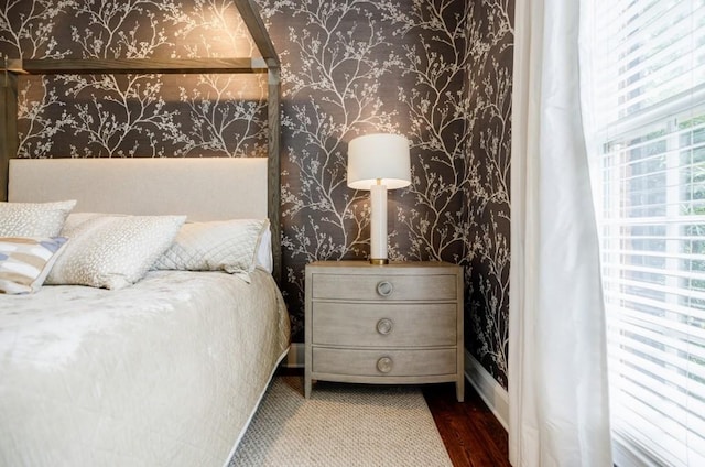 663 Clifton Rd NE, Atlanta, GA 30307 - bedroom featuring wallpapered walls, wood finished floors, and baseboards