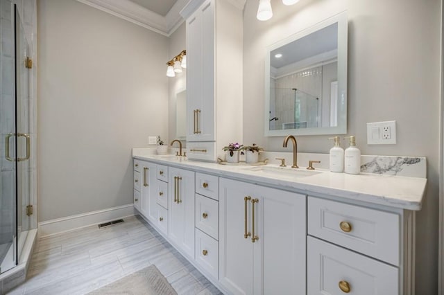 663 Clifton Rd NE, Atlanta, GA 30307 - full bath featuring double vanity, ornamental molding, a stall shower, and baseboards