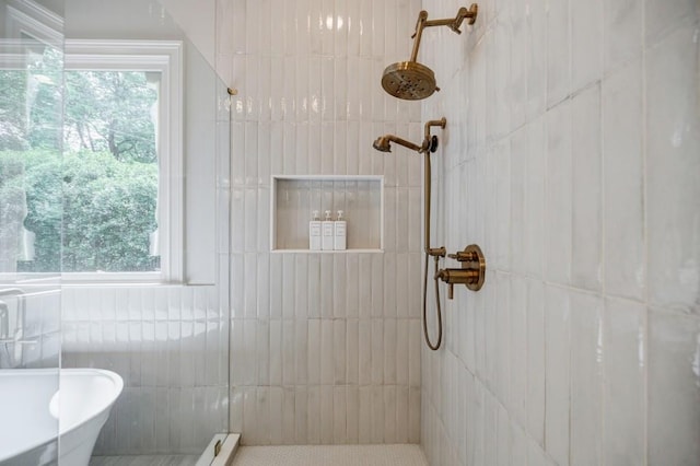 663 Clifton Rd NE, Atlanta, GA 30307 - bathroom with a tile shower, tile walls, plenty of natural light, and a freestanding bath