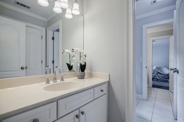 663 Clifton Rd NE, Atlanta, GA 30307 - bathroom featuring vanity, a chandelier, ornamental molding, tile patterned flooring, and baseboards