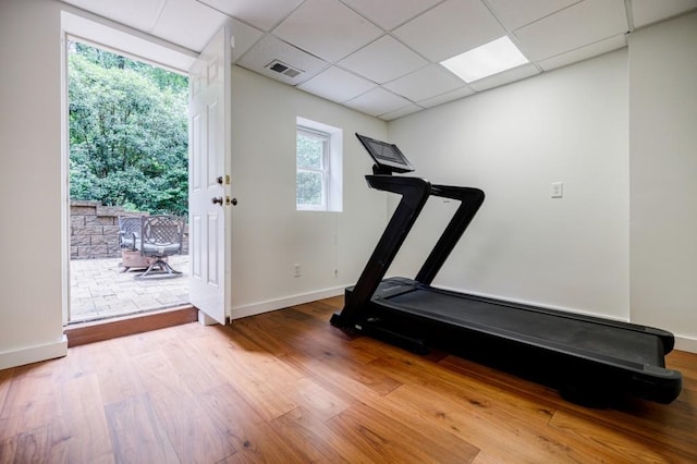 663 Clifton Rd NE, Atlanta, GA 30307 - workout room with wood finished floors, a drop ceiling, and baseboards