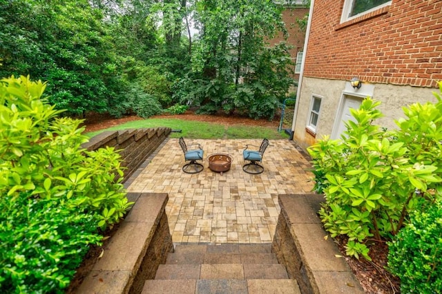 663 Clifton Rd NE, Atlanta, GA 30307 - view of patio featuring a fire pit