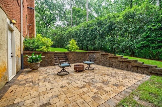 663 Clifton Rd NE, Atlanta, GA 30307 - view of patio featuring an outdoor fire pit and view of scattered trees