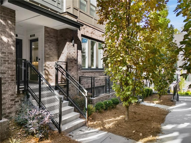 view of exterior entry with a porch