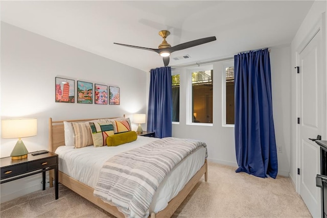 carpeted bedroom with ceiling fan