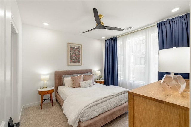 bedroom featuring ceiling fan and light colored carpet