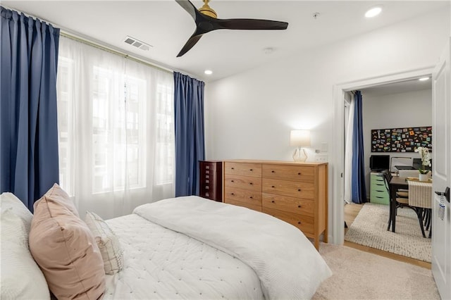 carpeted bedroom with ceiling fan