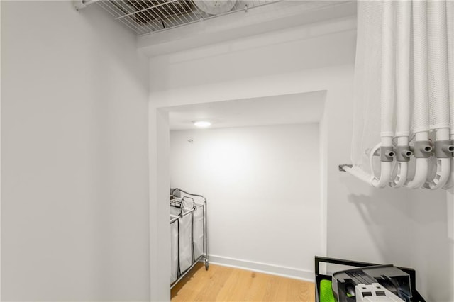 spacious closet featuring light hardwood / wood-style floors