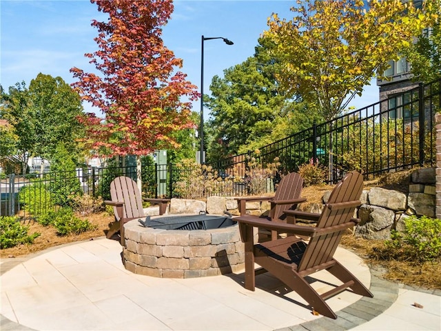 view of patio / terrace with a fire pit