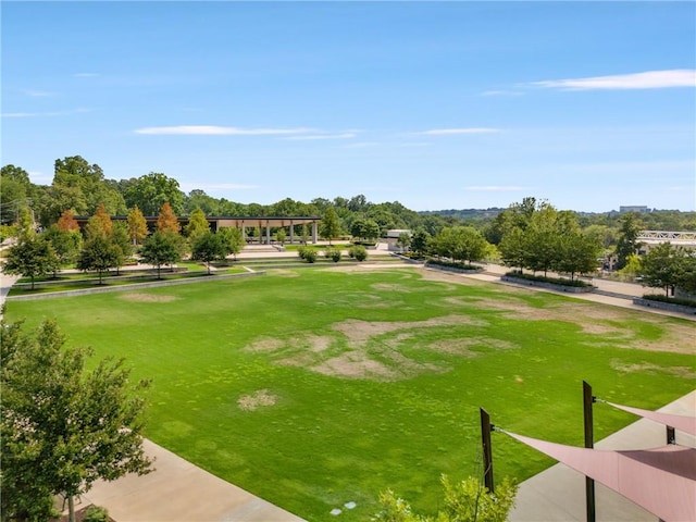 view of home's community featuring a lawn