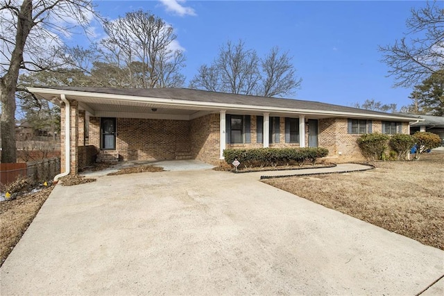 ranch-style house featuring a carport