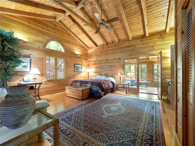 bedroom featuring wooden walls, wooden ceiling, and beamed ceiling