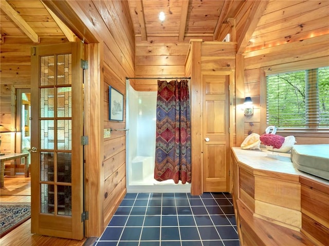 bathroom with wood ceiling, wood walls, vaulted ceiling with beams, and tile flooring