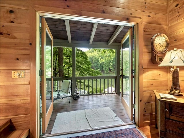 doorway featuring wood ceiling, a wealth of natural light, and hardwood / wood-style flooring