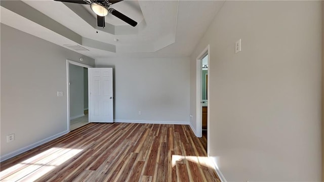 145 Charleston Pl, Covington, GA 30016 - interior space featuring a raised ceiling, wood finished floors, a ceiling fan, and baseboards