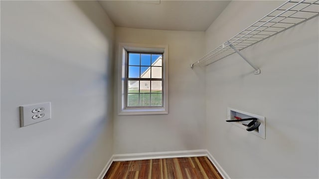 145 Charleston Pl, Covington, GA 30016 - laundry room with hookup for a washing machine, baseboards, wood finished floors, and laundry area