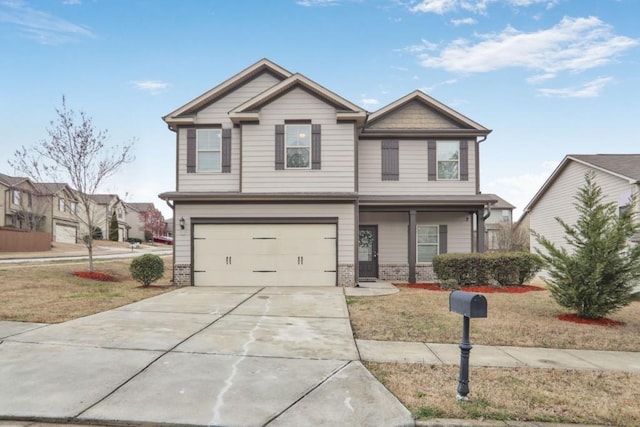 craftsman-style house with a front lawn, concrete driveway, brick siding, and an attached garage