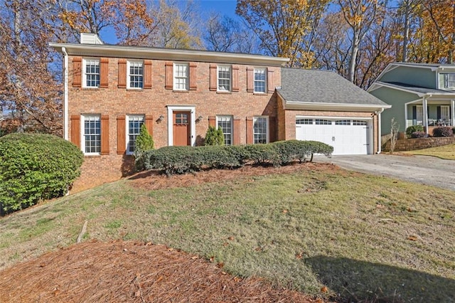 colonial inspired home with a front yard