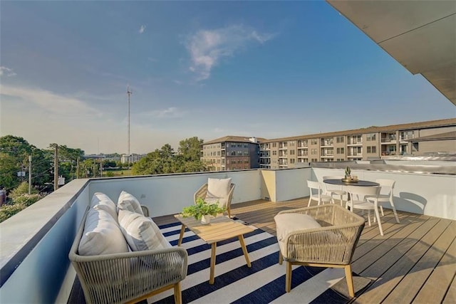 deck with outdoor dining area and an outdoor hangout area