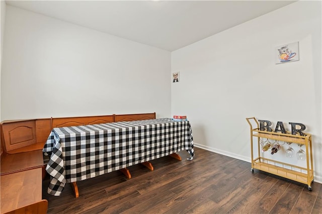 bedroom featuring dark hardwood / wood-style flooring