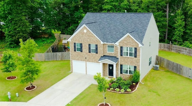 735 Sweethaven Ln, Loganville, GA 30052 - view of front of home featuring concrete driveway, a garage, roof with shingles, and cooling unit