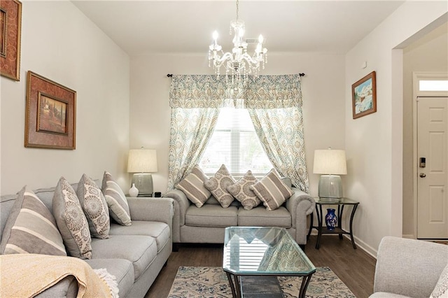 735 Sweethaven Ln, Loganville, GA 30052 - living area with a chandelier, healthy amount of natural light, and dark wood-type flooring