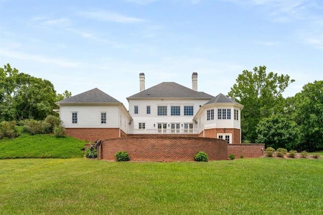 833 Hines Rd, Moreland, GA 30259 - back of property featuring brick siding, a lawn, and a chimney