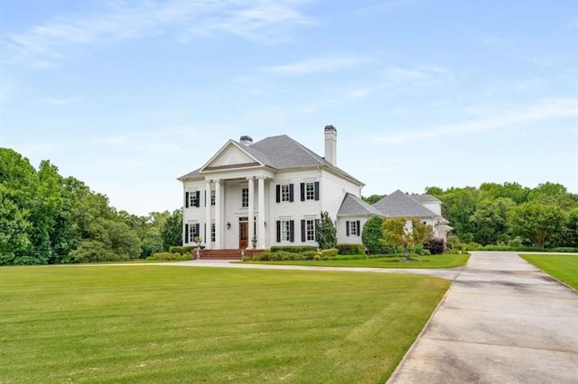 833 Hines Rd, Moreland, GA 30259 - greek revival house featuring a front lawn and a chimney