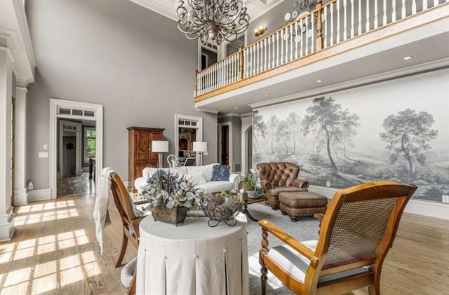 833 Hines Rd, Moreland, GA 30259 - dining room featuring a towering ceiling, wood finished floors, a chandelier, and ornamental molding