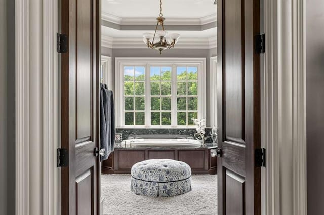 833 Hines Rd, Moreland, GA 30259 - full bath with a chandelier, a garden tub, crown molding, and a tray ceiling