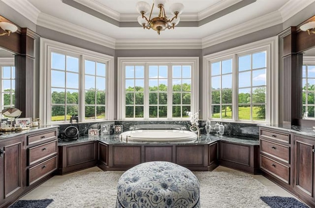 833 Hines Rd, Moreland, GA 30259 - full bath featuring a chandelier, tile patterned floors, a garden tub, a tray ceiling, and decorative backsplash