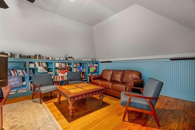 833 Hines Rd, Moreland, GA 30259 - living room with lofted ceiling, wood finished floors, a ceiling fan, and wainscoting