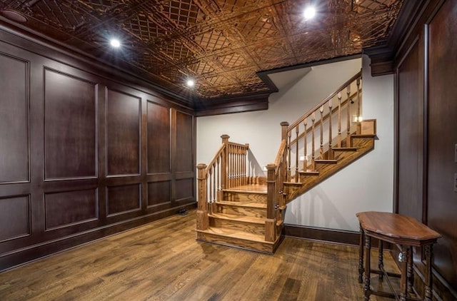 833 Hines Rd, Moreland, GA 30259 - stairway with wood finished floors, an ornate ceiling, and ornamental molding
