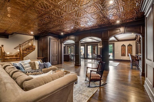 833 Hines Rd, Moreland, GA 30259 - home theater room with arched walkways, ornate columns, an ornate ceiling, ornamental molding, and dark wood-type flooring