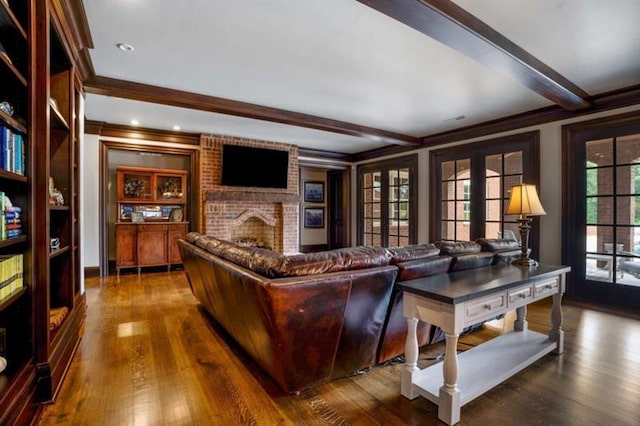 833 Hines Rd, Moreland, GA 30259 - living area with ornamental molding, beamed ceiling, dark wood-style floors, and a brick fireplace