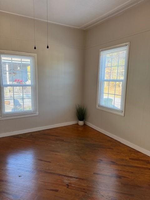 unfurnished room featuring dark hardwood / wood-style floors