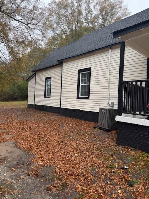 view of home's exterior with central AC