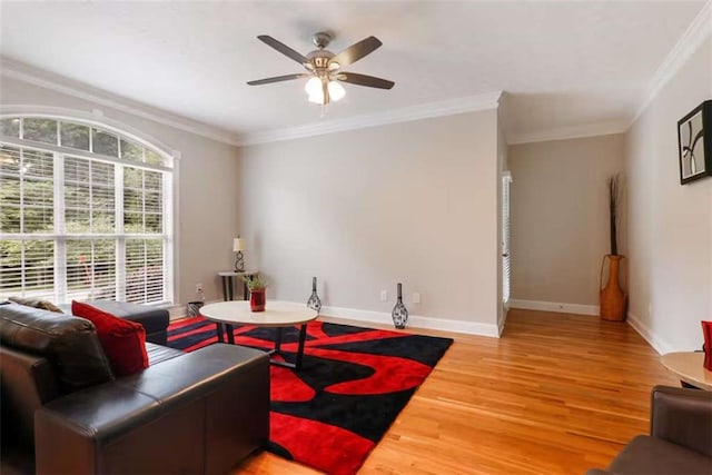 living room featuring crown molding, ceiling fan, and hardwood / wood-style flooring