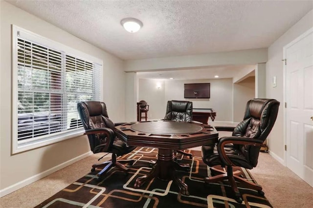 carpeted home office with a textured ceiling and billiards