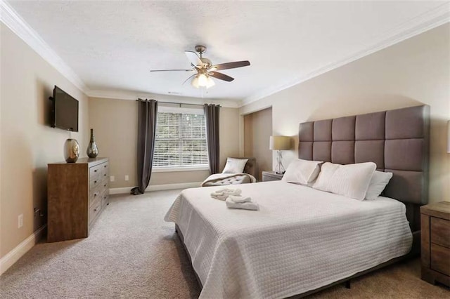 bedroom with light colored carpet, ceiling fan, and ornamental molding