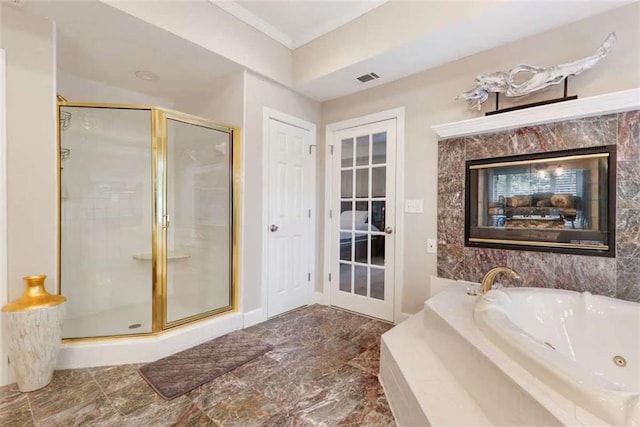 bathroom featuring plus walk in shower and a fireplace