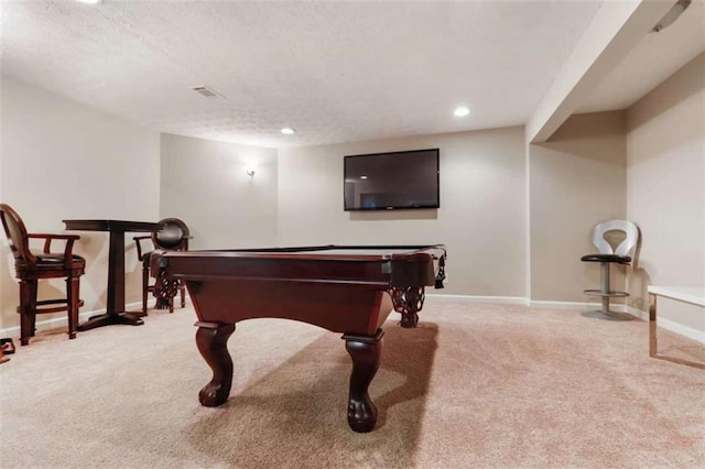 game room featuring light colored carpet, a textured ceiling, and billiards