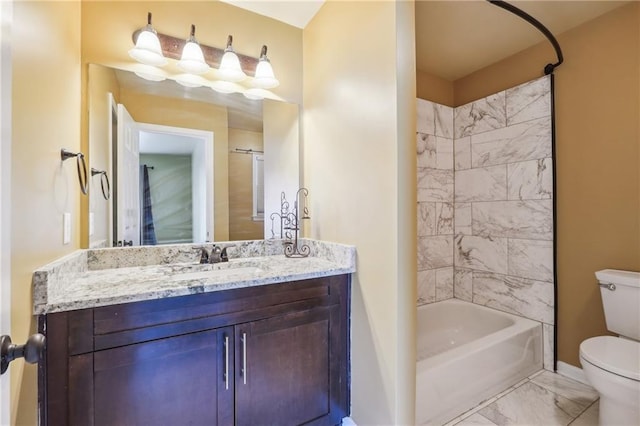 full bathroom featuring toilet, vanity, and tiled shower / bath combo